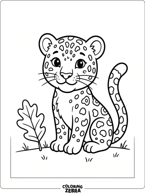 A cute leopard cub sitting next to a leaf