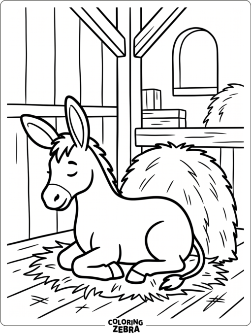 A donkey resting beside hay in a barn