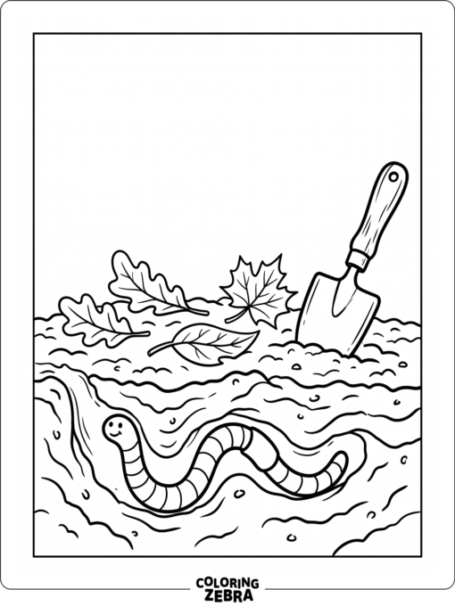 Earthworm in soil with leaves and a shovel