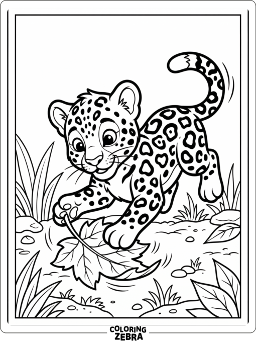 A jaguar cub playing with a leaf