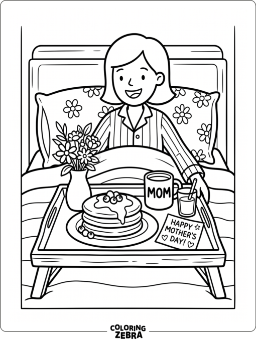 Breakfast tray with pancakes, juice, flowers, and a note