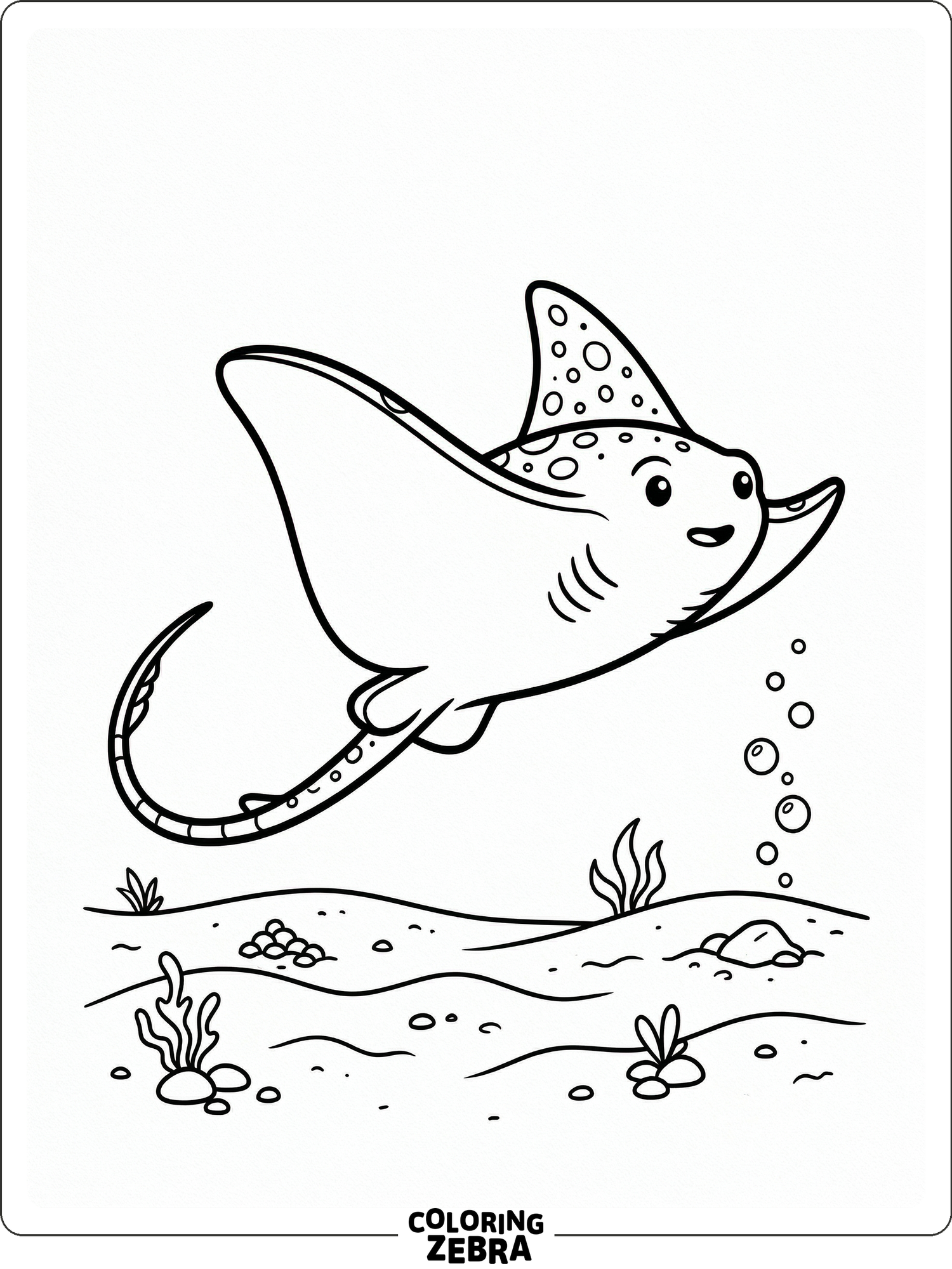 A stingray gliding over the ocean floor with bubbles