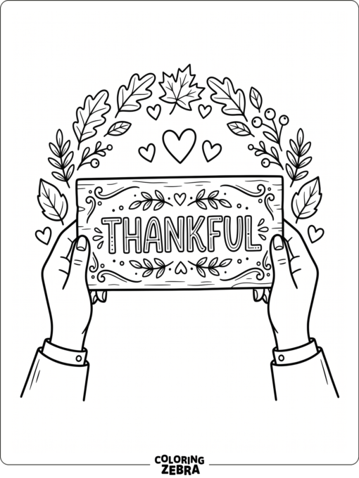Hands holding a thankful sign with leaves and hearts