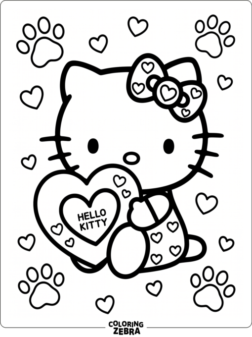 A kitten holding a heart pillow