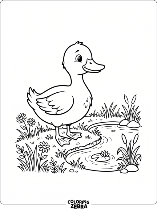 A bright yellow duck by a pond